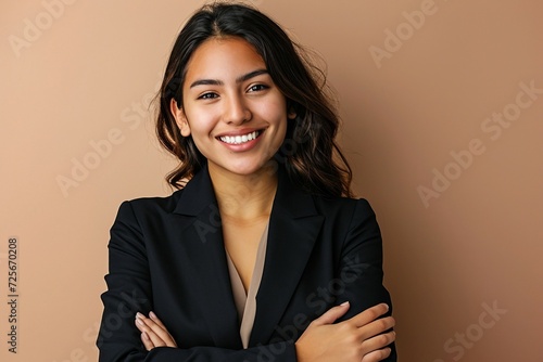 a woman smiling with arms crossed