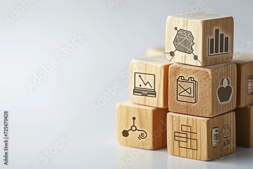 a stack of wooden cubes with icons on them