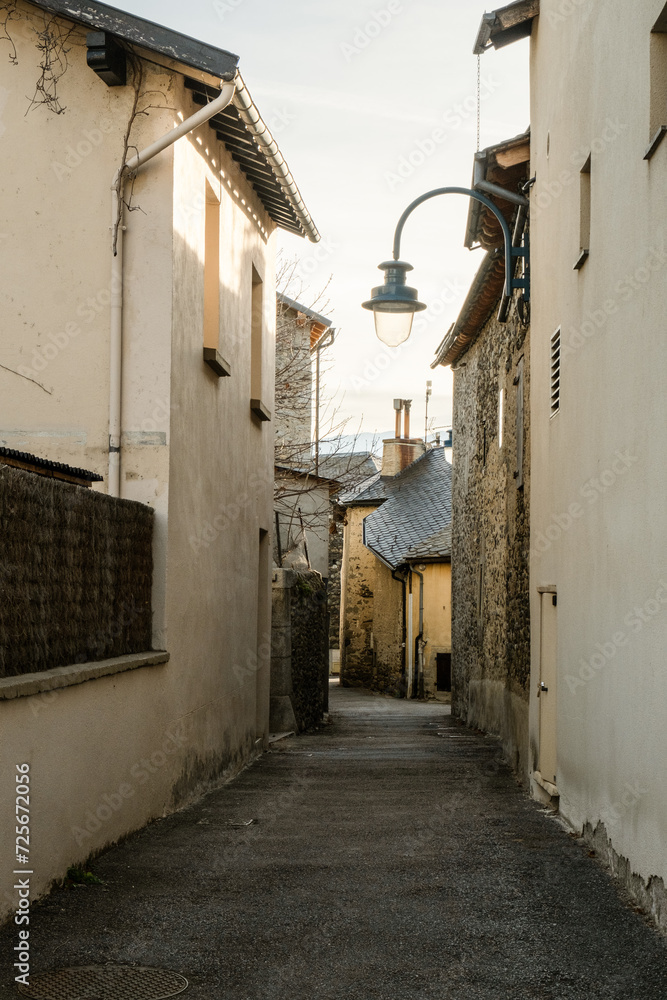 Small street alley in an old town in the mountains of Europe