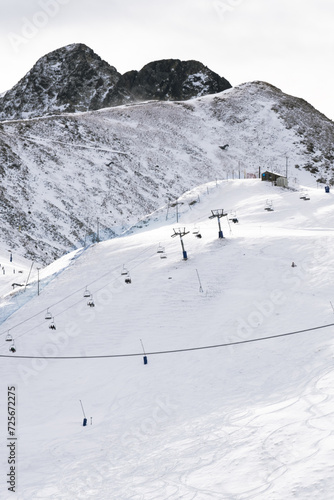 Wallpaper Mural Skiers in the white snow mountains between the city buildings. Snow sports court. Learning grounds for amateur sports and family. Torontodigital.ca