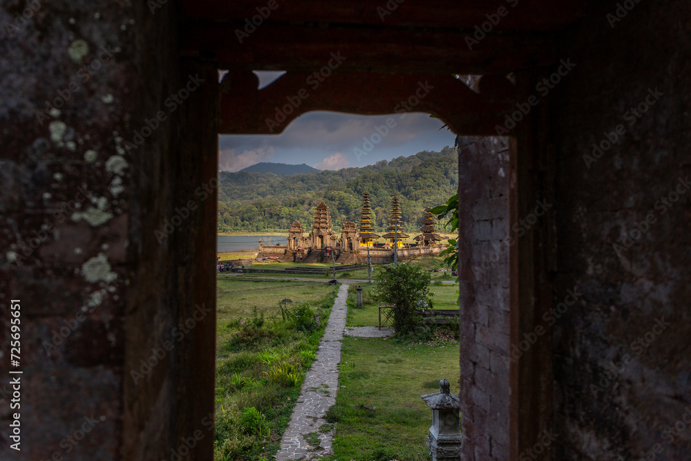 A view of Pura Ulun Danu Bratan temple through a doorway in north Bali, Indonesia. A view of Pura Ulun Danu Bratan temple through a doorway in north Bali, Indonesia.