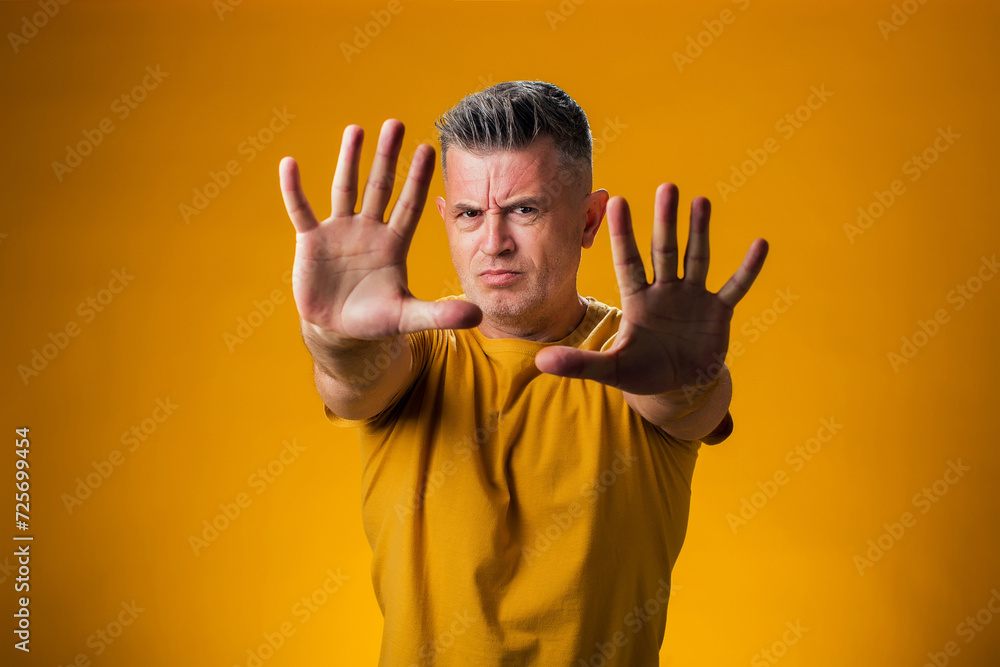 Man showing stop gesture. People and emotion concept Man showing stop gesture. People and emotion concept