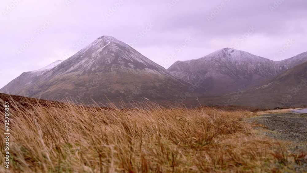 View of beautiful countryside in the Scottish highland with mountains, trees and sea View of beautiful countryside in the Scottish highland with mountains, trees and sea