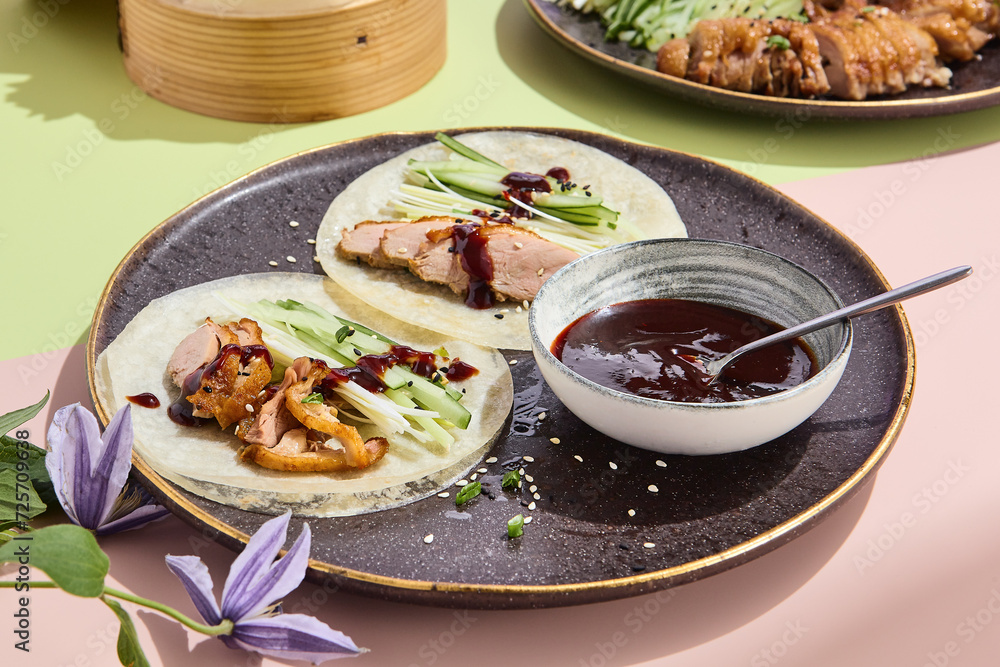 Elegant Peking duck rice pancakes with hoisin sauce, perfect for a sophisticated restaurant menu