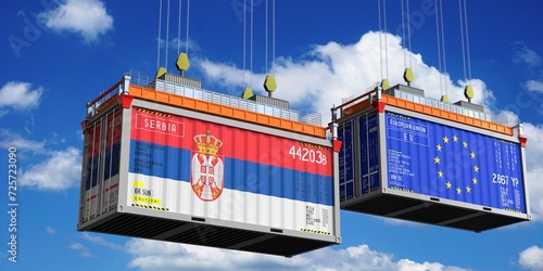 Shipping containers with flags of Serbia and European Union - 3D illustration photo