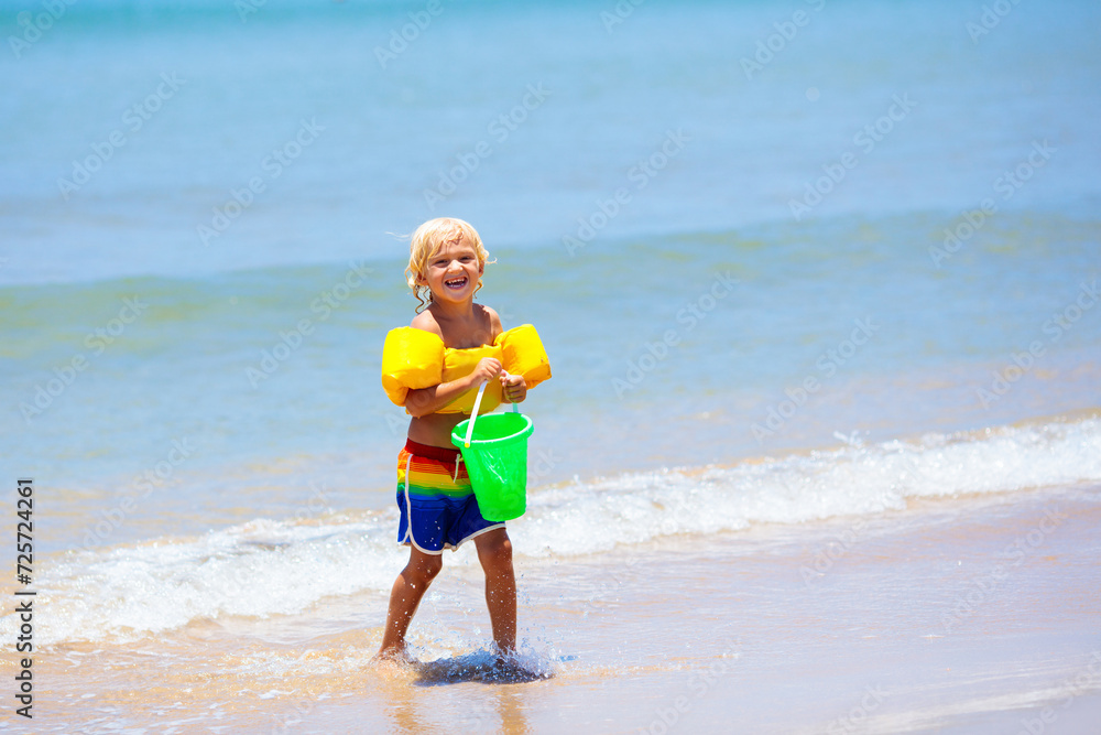 Kids playing on beach. Children play at sea. Kids playing on beach. Children play at sea.