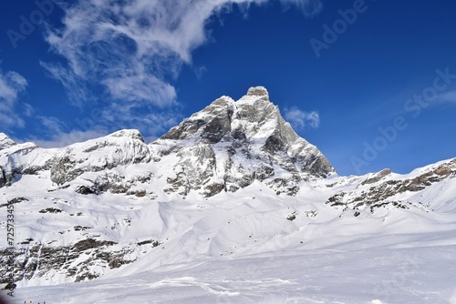 Beautiful snowcapped Matterhorn from ski slopes in Cervinia Valtournenche ski resort, Italian Alps. Snowy mountain peak that borders Italy and Switzerland.