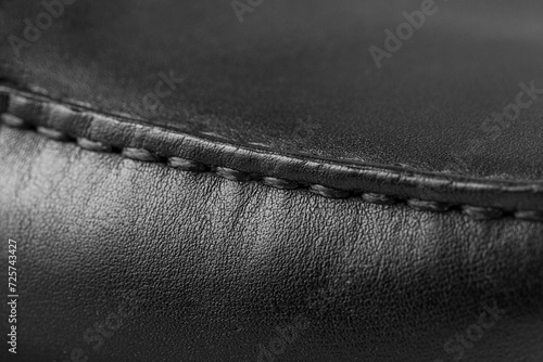 texture of black leather with thread stitching