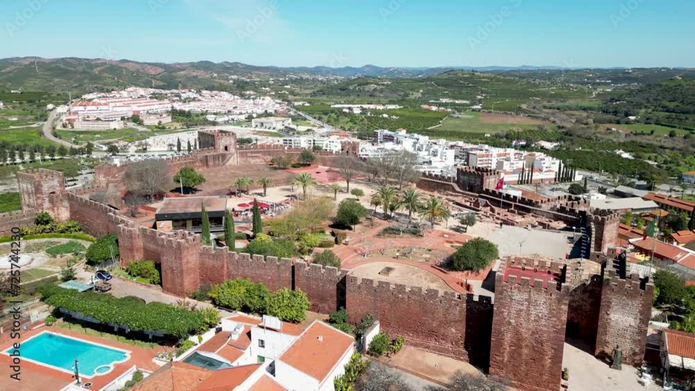 Moorish Castle of Silves, Algarve, Portugal with towers, walls, green parks, by 4K drone Moorish Castle of Silves, Algarve, Portugal with towers, walls, green parks, by 4K drone