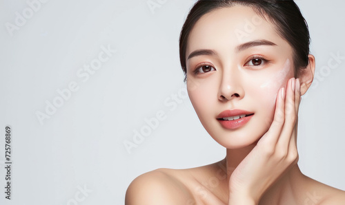 Beautiful young asian woman with clean fresh skin on white background,Facial treatment, Cosmetology.