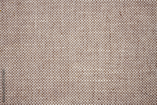Background of light brown colored fabric.