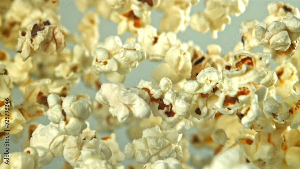 Popcorn flies up and falls down. On a light background. Filmed on a high-speed camera at 1000 fps. High quality FullHD footage Popcorn flies up and falls down. On a light background. Filmed on a high-speed camera at 1000 fps. High quality FullHD footage