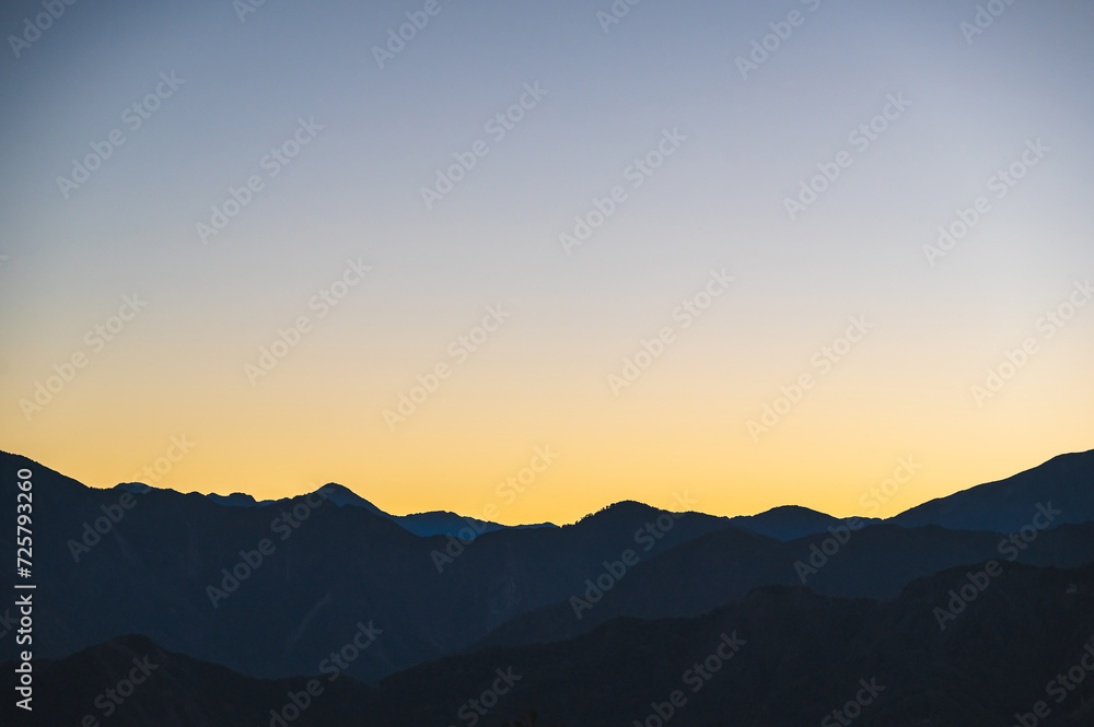 Fototapeta premium Breathtaking sunrise vista from Alishan Mountain, Taiwan. The Alishan National Scenic Area is a mountain retreat and nature reserve situated in Alishan Township, Chiayi County, Taiwan.
