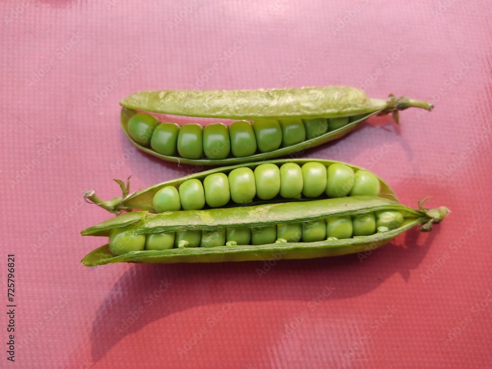 custom made wallpaper toronto digitalFront view. Green peas isolated on a Red background. Fresh green peas, macro food photo closeup Shot.