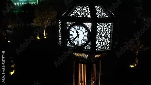 The drone rises over the clock tower with its subject locked on, as not to lose the framing. This clock tower is located in Lahore, Pakistan. photo