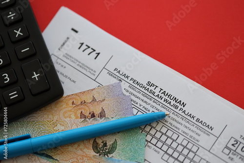 Indonesian tax form 1771 corporate taxpayers annual income tax return with pen lies on accountant table photo