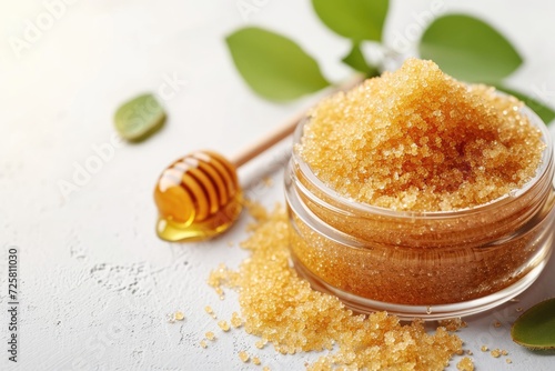 Homemade lip scrub using brown sugar honey and olive oil on a white background photo