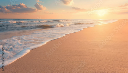 Sunset illuminating the waves and sandy beach