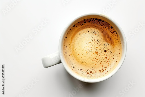 Top view of a white cup of coffee with foam isolated and in focus