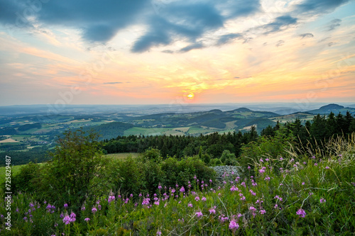 Wasserkuppe - panoramic view from the Radom observatory on the Wasserkuppe in the Hessian Rhön in summer towards Fulda in the sunset, Hessen, Germany photo