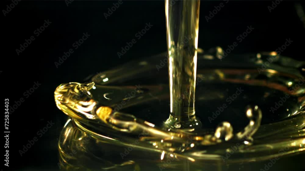 Olive oil with splashes on black background. Filmed on a high-speed camera at 1000 fps. High quality FullHD footage Olive oil with splashes on black background. Filmed on a high-speed camera at 1000 fps. High quality FullHD footage