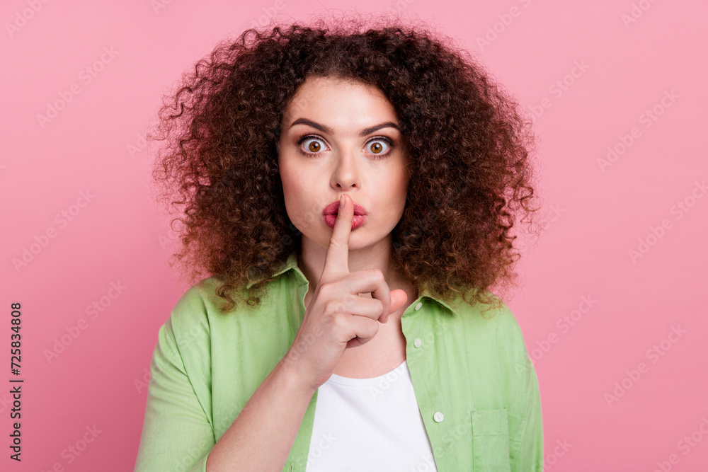 Photo portrait of pretty young girl shh silence gesture keep secret wear trendy green outfit isolated on pink color background Photo portrait of pretty young girl shh silence gesture keep secret wear trendy green outfit isolated on pink color background