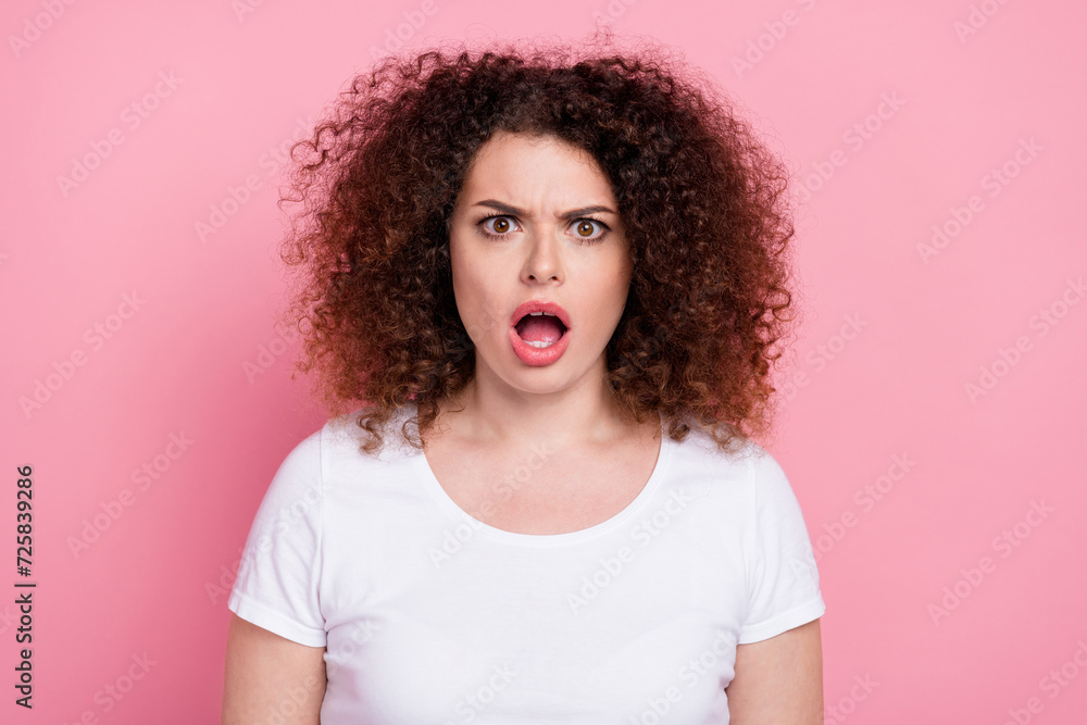 Portrait of offended speechless stunned girl with wavy hairstyle wear white t-shirt staring open mouth isolated on pink color background Portrait of offended speechless stunned girl with wavy hairstyle wear white t-shirt staring open mouth isolated on pink color background