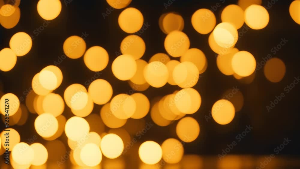 Blurred golden lights on a black background, bokeh lights Blurred golden lights on a black background, bokeh lights