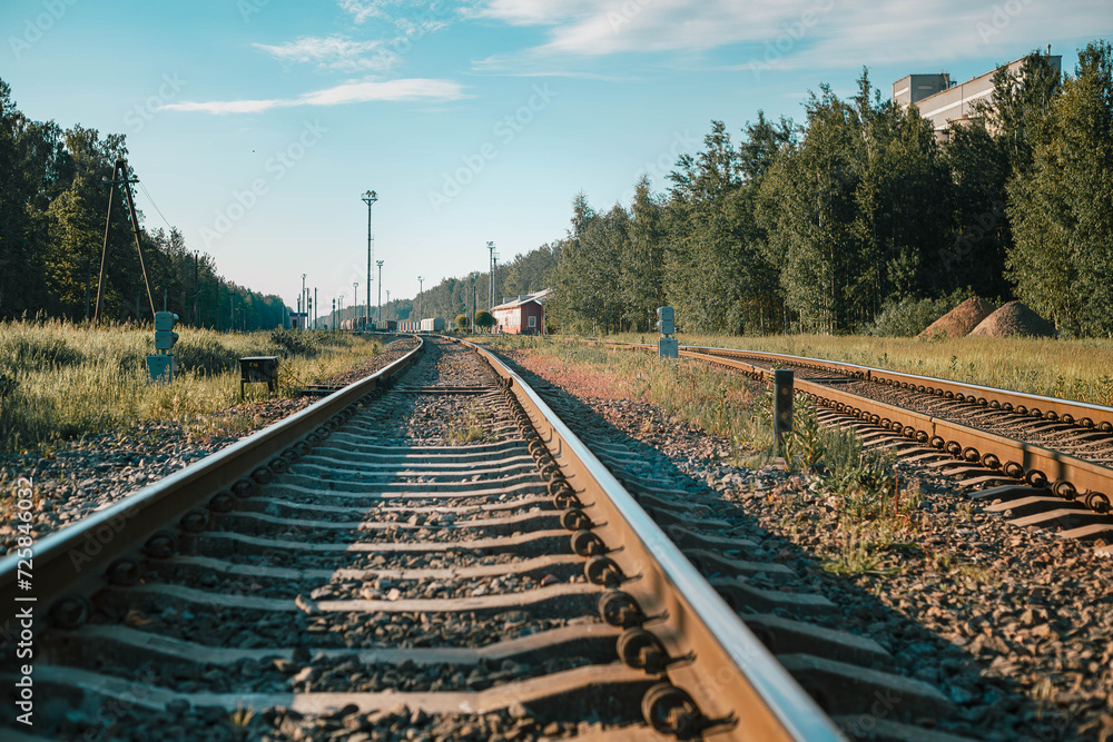 Fototapeta premium railway going into the distance towards the station
