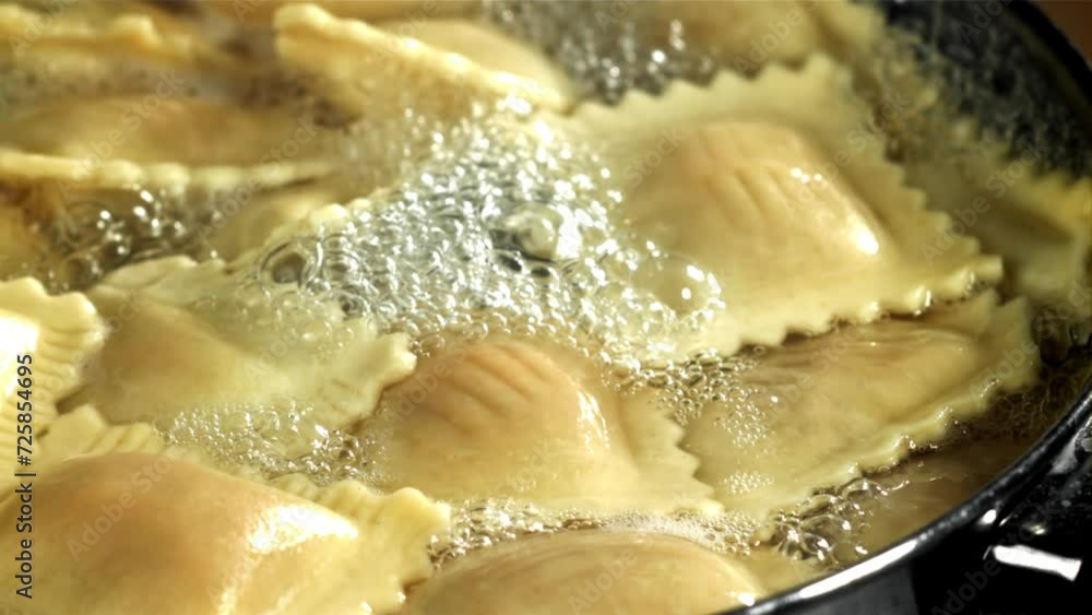 Ravioli pasta in boiling water. Filmed on a high-speed camera at 1000 fps. High quality FullHD footage Ravioli pasta in boiling water. Filmed on a high-speed camera at 1000 fps. High quality FullHD footage