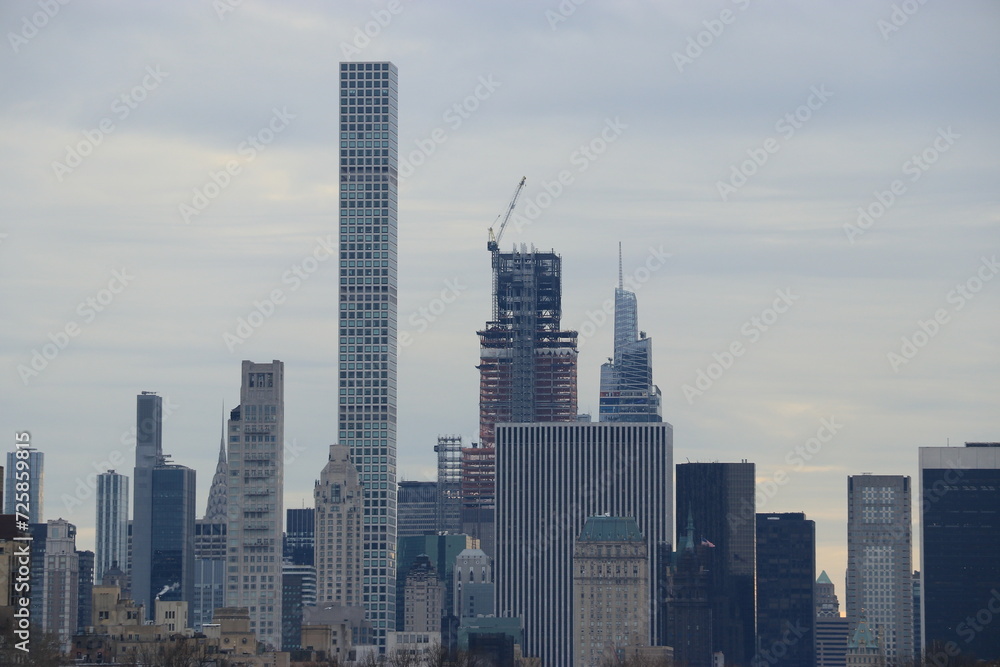 New York City skyline from Central Park Lake with reflection in the water, in focus 432 Park Avenue, Rafael vinioly