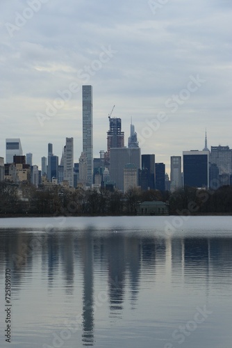 New York City skyline from Central Park Lake with reflection in the water