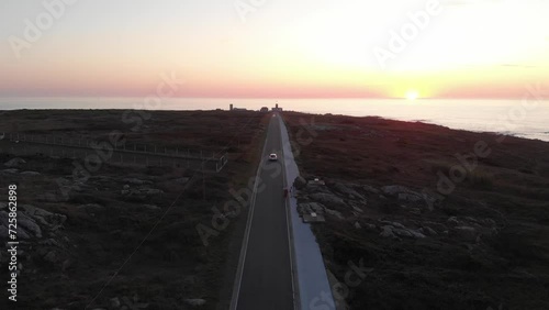 Vista aérea de la carretera del Faro de Corrubedo durante la puesta de sol photo