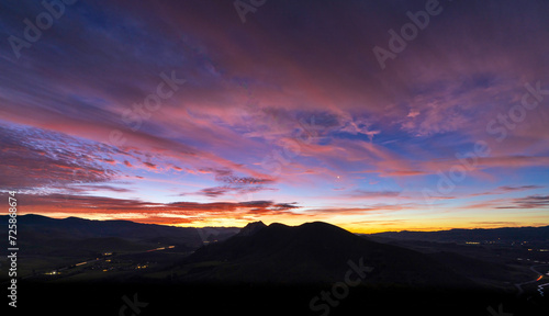 Sunrise, sunset in the mountains, magenta skies, clouds © Mark