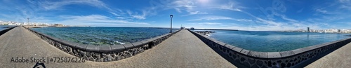 Walking the Arrecife, Lanzarote seaside promenade offers a blend of coastal charm and Canarian architecture. photo