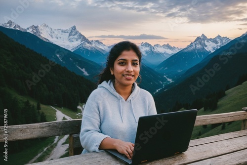 A remote employee working on laptop in cold weather, surrounded by a snowy landscape, showcasing the adaptability of working from anywhere, even in freezing conditions. © Portrait Studio