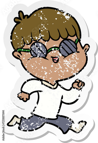 distressed sticker of a cartoon boy wearing sunglasses and running © lineartestpilot