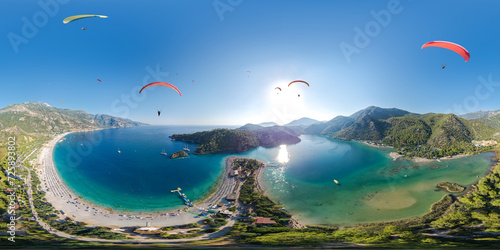 Fototapeta Naklejka Na Ścianę i Meble -  360 degree panoramic view of the lagoon in Oludeniz where paragliders fly. A popular tourist resort for extreme sports enthusiasts in Turkey. Aerial seamless spherical panorama