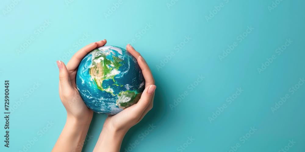 Two hands cradle a miniature Earth against a vivid blue background, symbolizing care and responsibility for our planet.
Two hands cradle a miniature Earth against a vivid blue background, symbolizing care and responsibility for our planet.