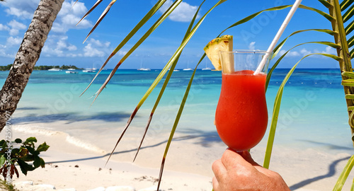 Travel background with drinks Bocal on Caribbean beach.