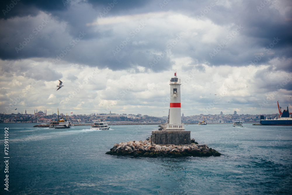 Ferry traffic and a lighthouse near Kadikoy pier in asian side of istanbul, Turkey.