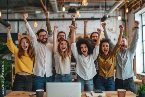 Diverse business team employees celebrating good news with their fists up in the air. Business win, corporate success