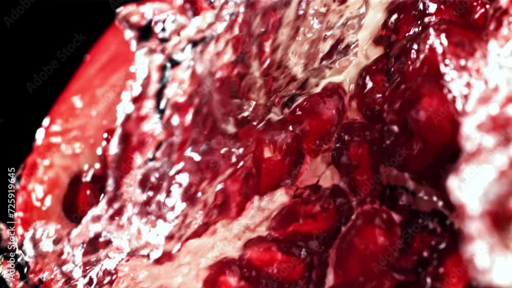 Splashed water pours onto fresh pomegranates. Filmed on a high-speed camera at 1000 fps. High quality FullHD footage Splashed water pours onto fresh pomegranates. Filmed on a high-speed camera at 1000 fps. High quality FullHD footage