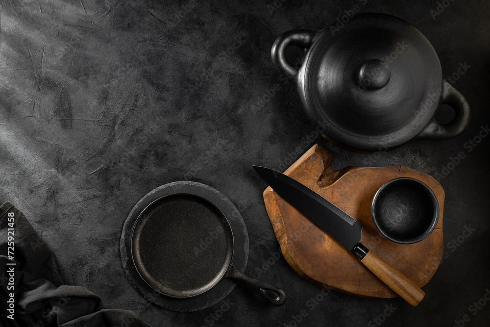 Fototapeta premium Black pots, pans and kitchen utensils.