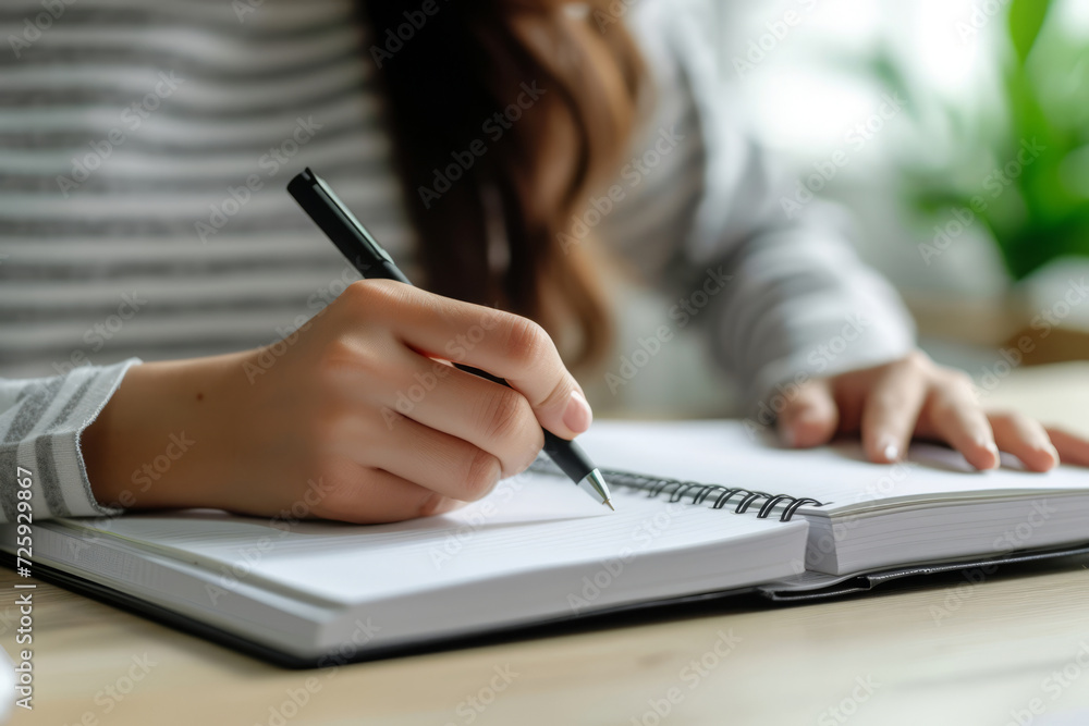 Hand with notebook for studying, learning and creative notes for academic class. Student writes information. Generative AI Hand with notebook for studying, learning and creative notes for academic class. Student writes information. Generative AI