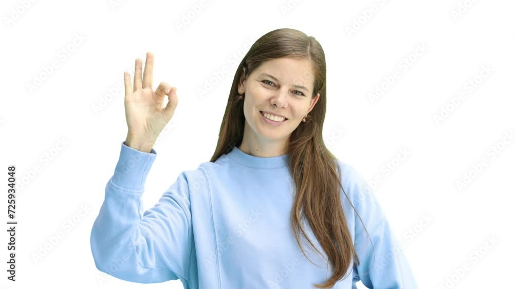A woman, close-up, on a white background, shows an ok sign A woman, close-up, on a white background, shows an ok sign
