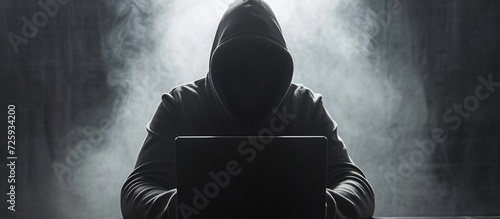 Hooded criminal hacks website to steal confidential data, receives system breach notification.