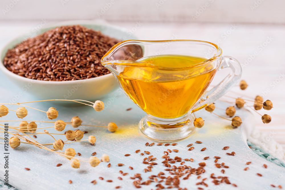 Brown linen seeds, flaxseed vegetable oil on white wooden background. Brown linen seeds, flaxseed vegetable oil on white wooden background.