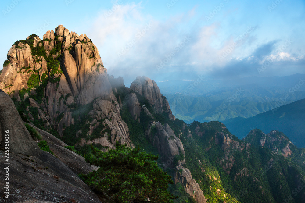 Mist creeps across Lotus Flower Peak in the Yellow Mountains of China.