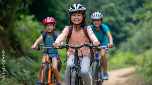 Asian family's active day out cycling in rural areas